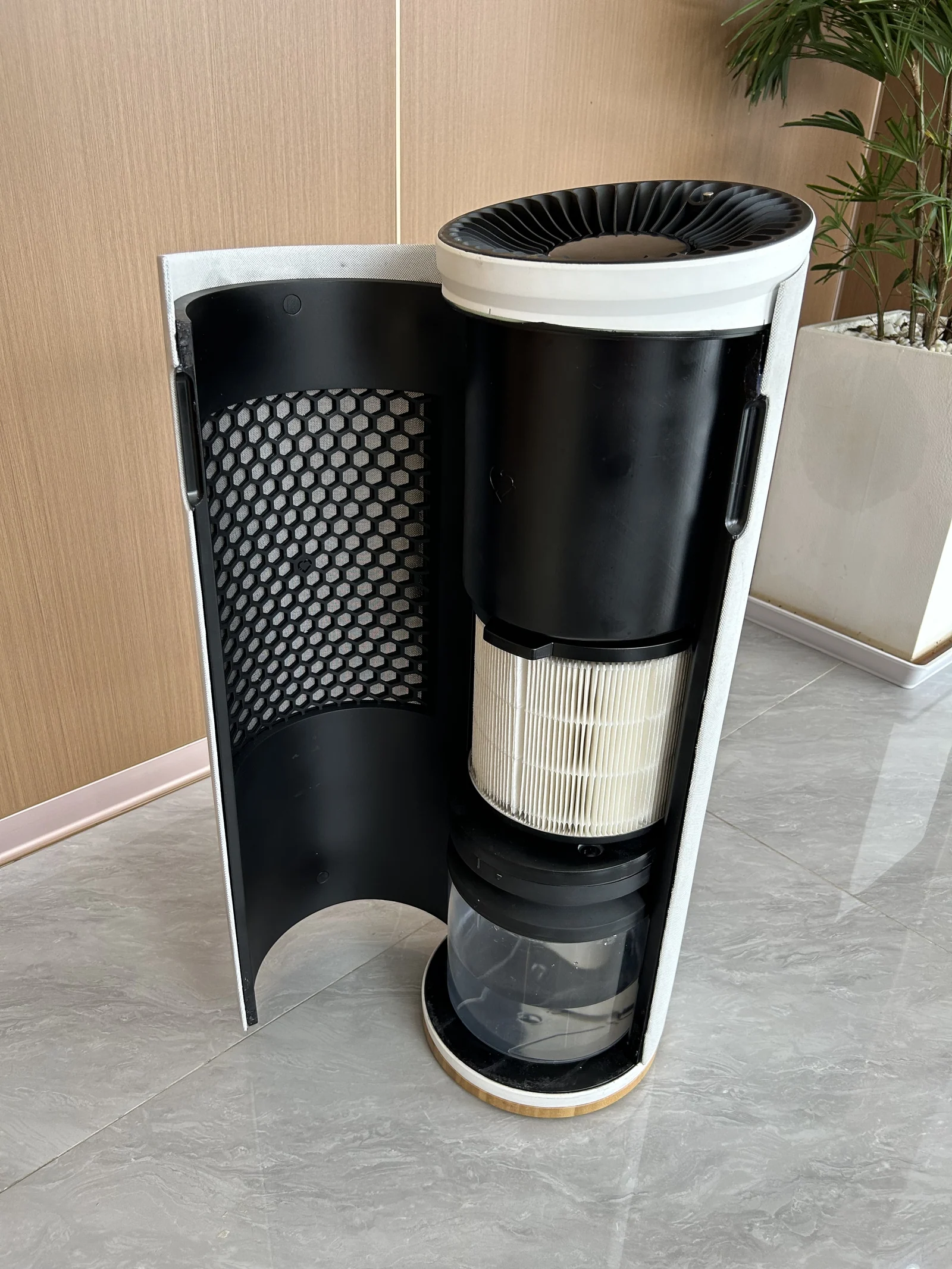 Prototype opened to show the filter and humidifier stack